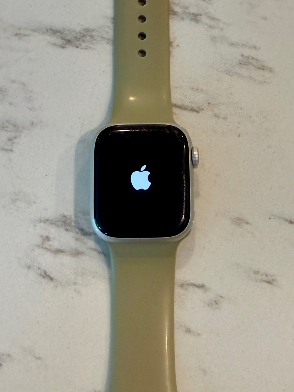 Apple Watch Series 7, 41mm with neutral Sport Band and Silver Aluminum Case